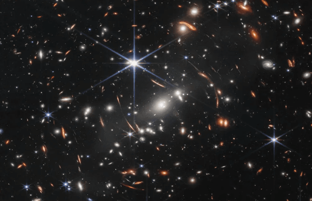 Gravitational lens shows a galaxy just 800 million years post-Big Bang